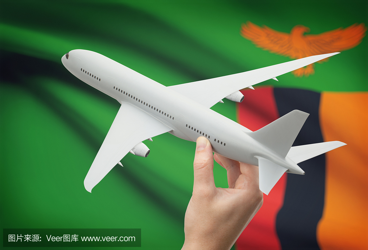 飞机在手上与国旗在背景 - 赞比亚