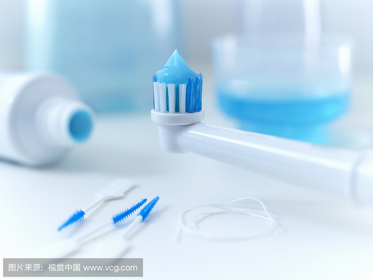 Close up of toothpaste on electric toothbrush