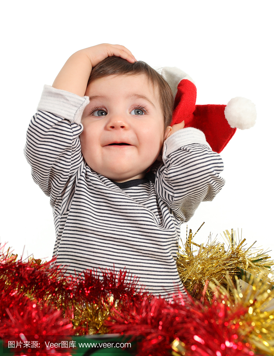 八个月宝宝在一个盒子摆放与圣诞老人的帽子