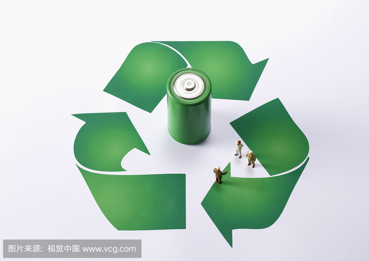 High angle view of recycling symbol with green 