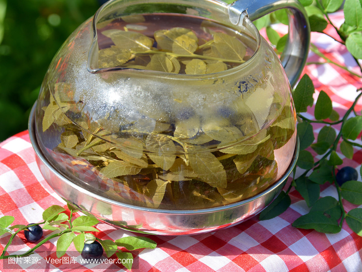 Health herbal tea of bilberry leaves in the kettle