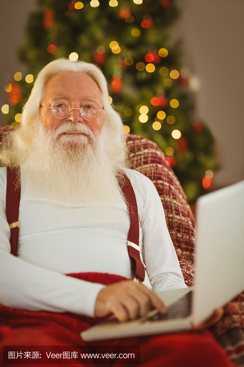 快乐圣诞老人克劳斯打字笔记本电脑