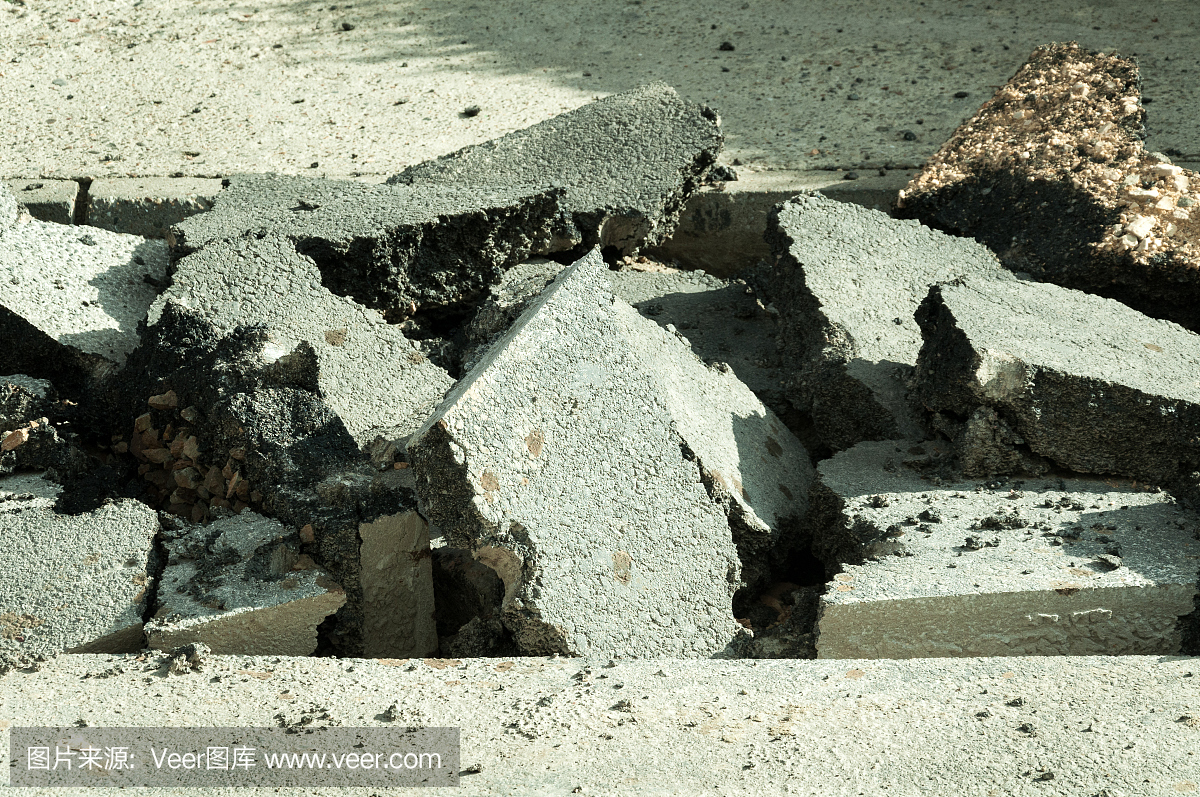 Old cracked asphalt prepared for excavation an