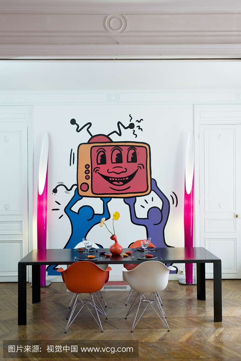 Pop-art mural on wall in dining room of period a