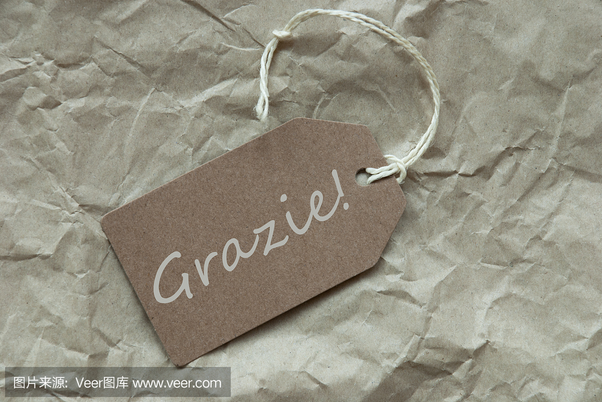 米色标签与意大利语Grazie意味着谢谢
