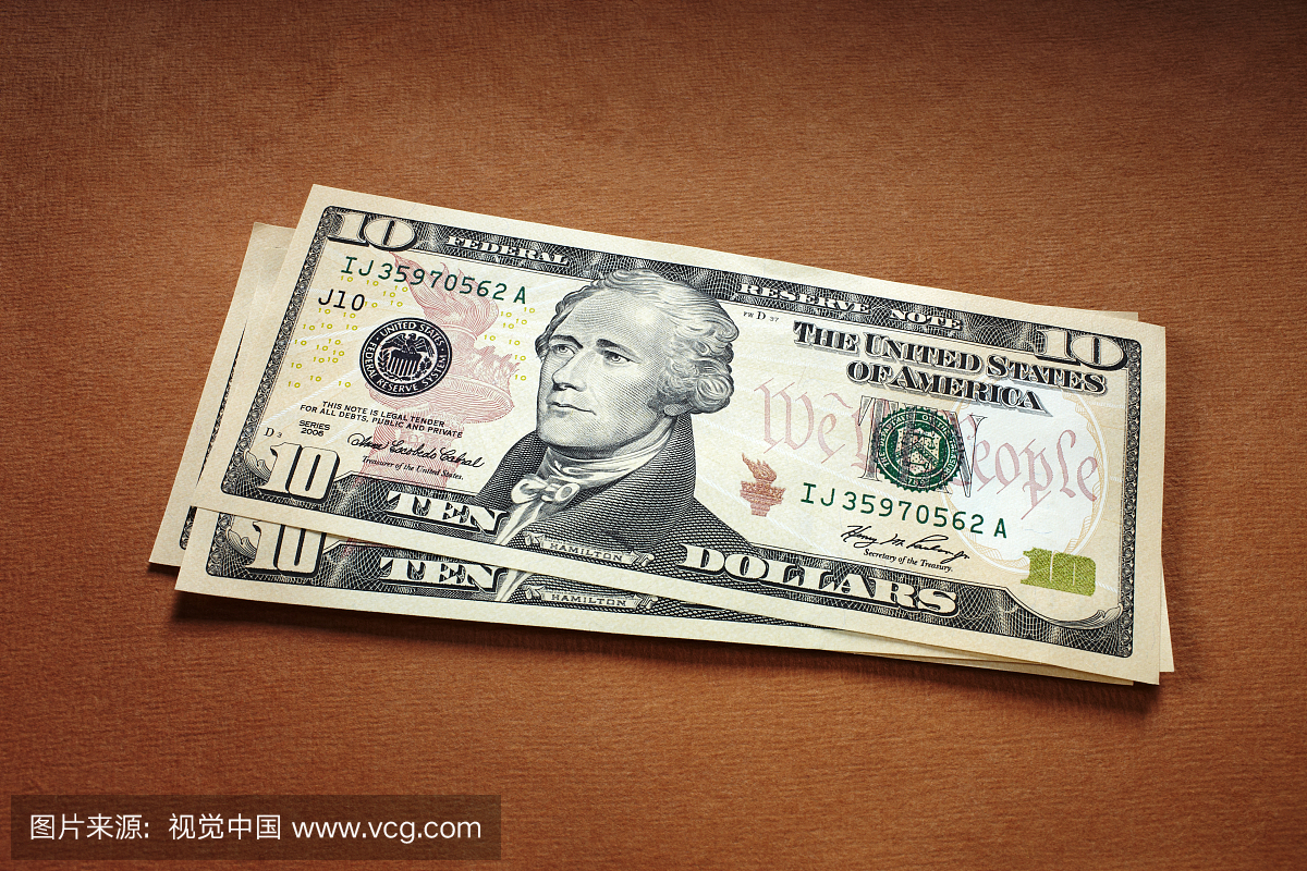 一卷美元的钞票高清摄影大图-千库网