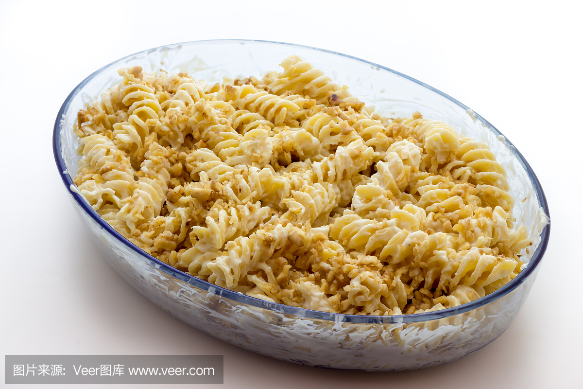 Fusilli pasta with sauce and nuts